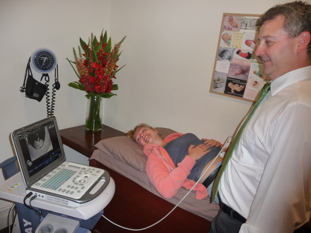 Dr Roberts performing pregnancy ultrasound